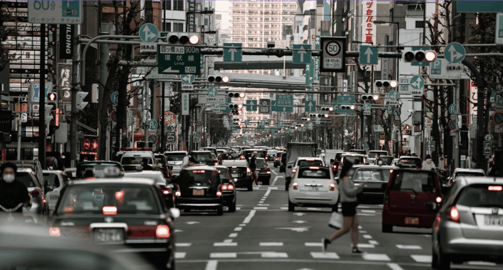 Busy Korean city street with traffic and pedestrians